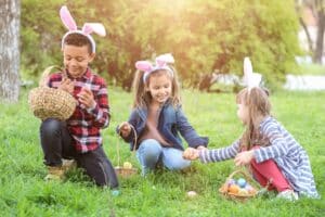 Little,Children,Gathering,Painted,Eggs,In,Park.,Easter,Hunt